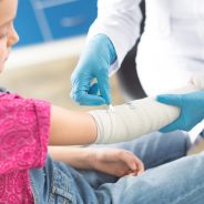 doctor-in-white-coat-and-medical-gloves-bandaging-2024-11-17-15-30-10-utc-min